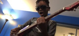 9-year-old guitar prodigy pays it forward