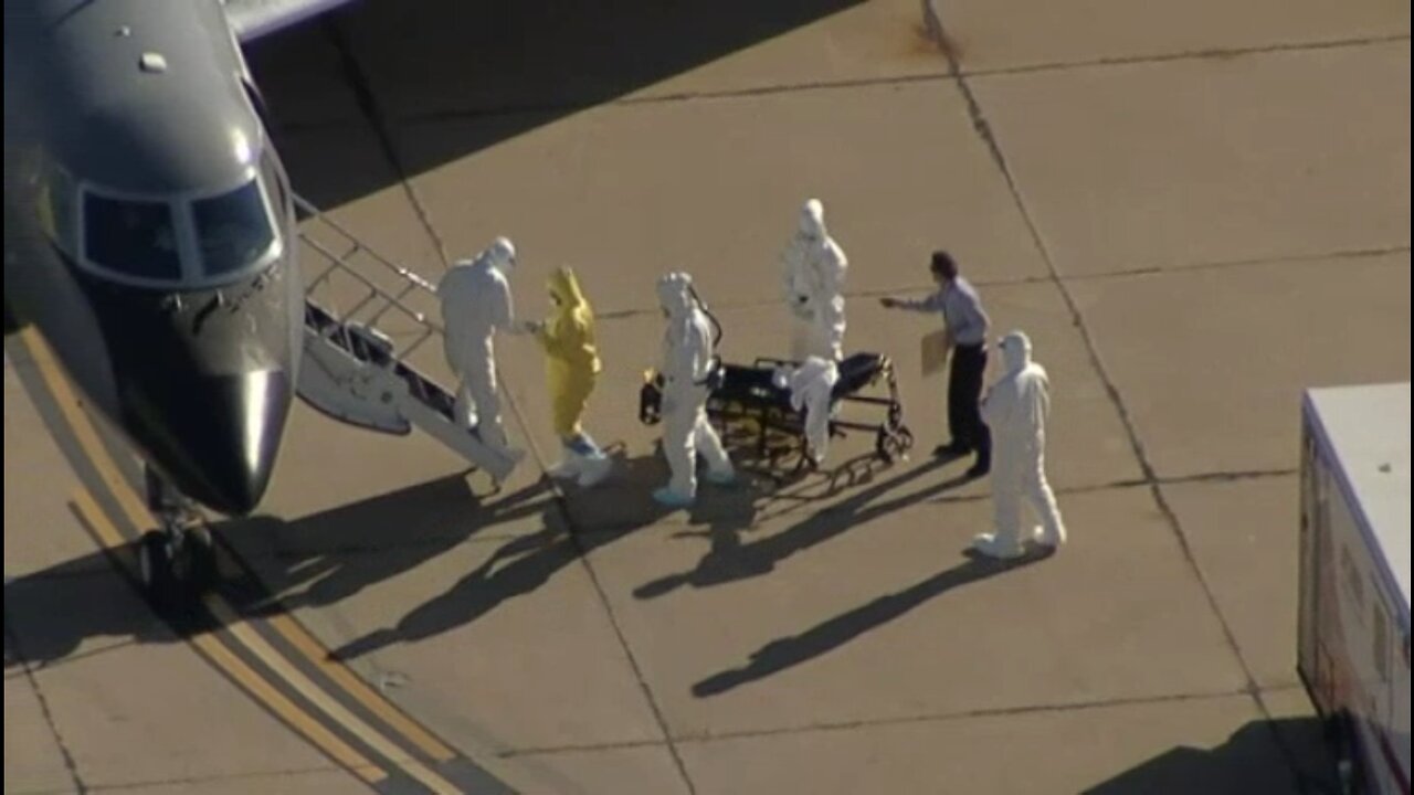 2014: “clipboard guy” Escorts “Ebola Infectee” Amber Vinson from Dallas Love Field