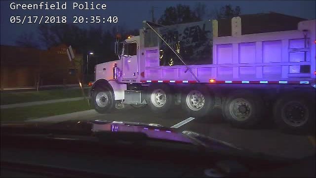 Greenfield Police help stop a moving dump truck, driver found unresponsive