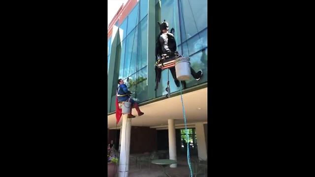 Superheroes wash windows at Akron Children's Hospital