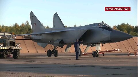A pair of MiG-31BM high-altitude fighter-interceptors cover the Northern Fleet naval group during...