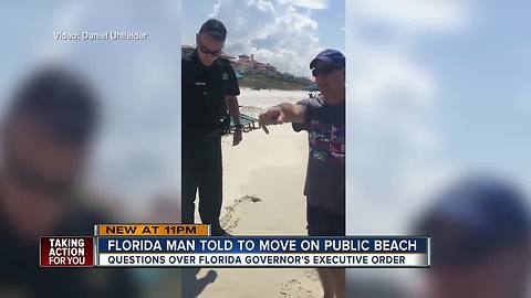 VIDEO: Deputies tell man to leave portion of public beach for trespassing following new beach law