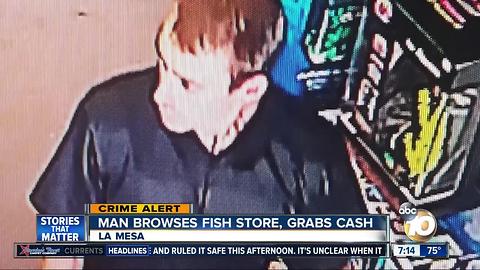 Man browses La Mesa fish store, grabs cash