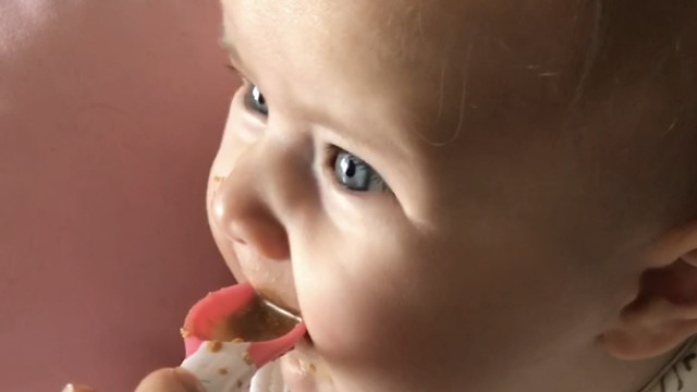 Baby tries food for the first time