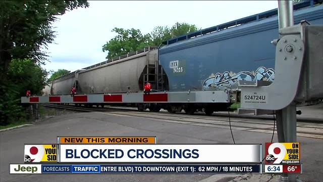 Stopped trains blocking railroad crossings