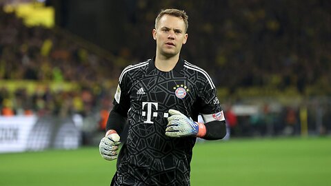 A fan slaps Manuel Neuer in the face