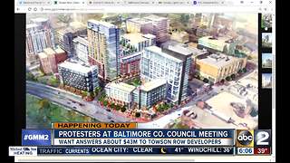 100+ community members protesting Towson Row project