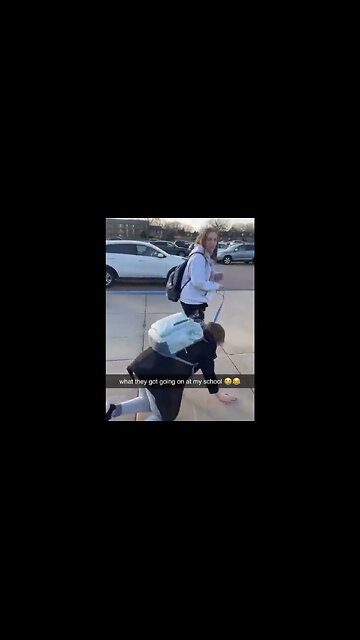 Student Walks Another Student Like A Dog Outside School