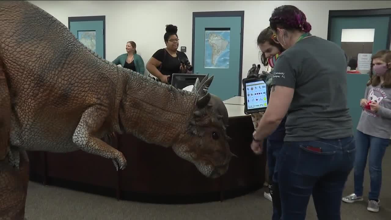 Dinosaurs invade Tampa school to interact with special needs students