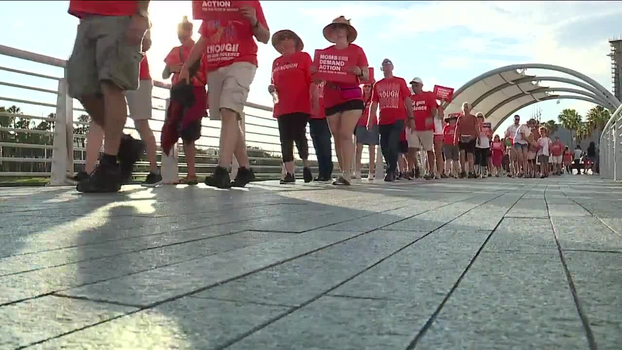 Dozens of people marched along Tampa Riverwalk to bring awareness to gun violence