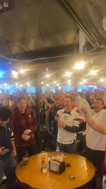 US soccer fans cheer at 1-0 score in US vs. Iran World Cup match