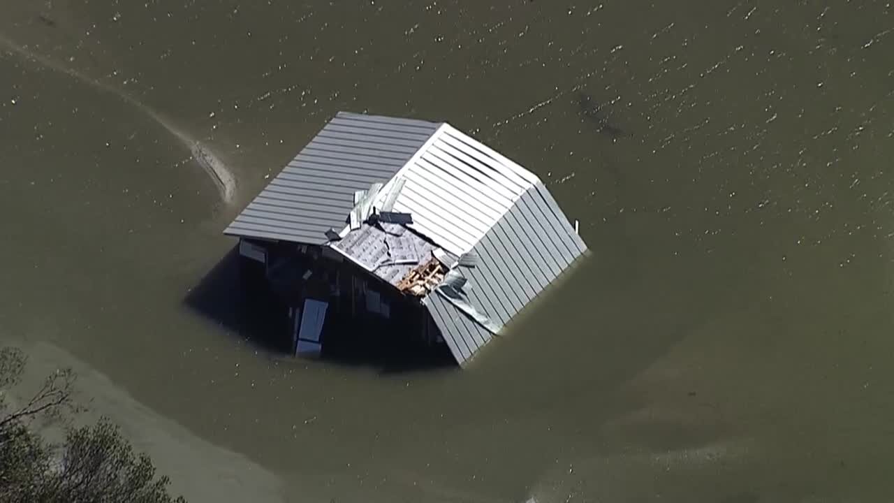 Chopper footage of home in Lee County completely under water.