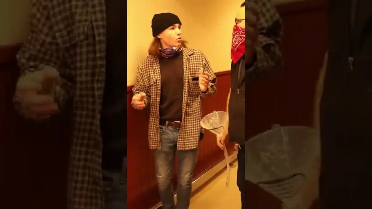 Beer Bong Next to Store Worker