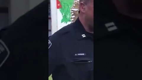 Thomas Rousseau, leader of #PatriotFront, is being led away in cuffs.