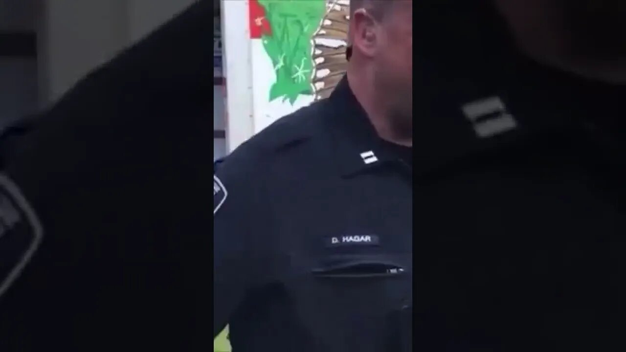 Thomas Rousseau, leader of #PatriotFront, is being led away in cuffs.