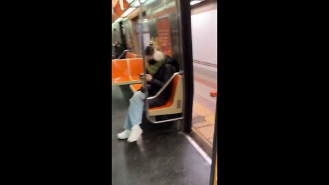 Naked man gets tattoo in NY Subway