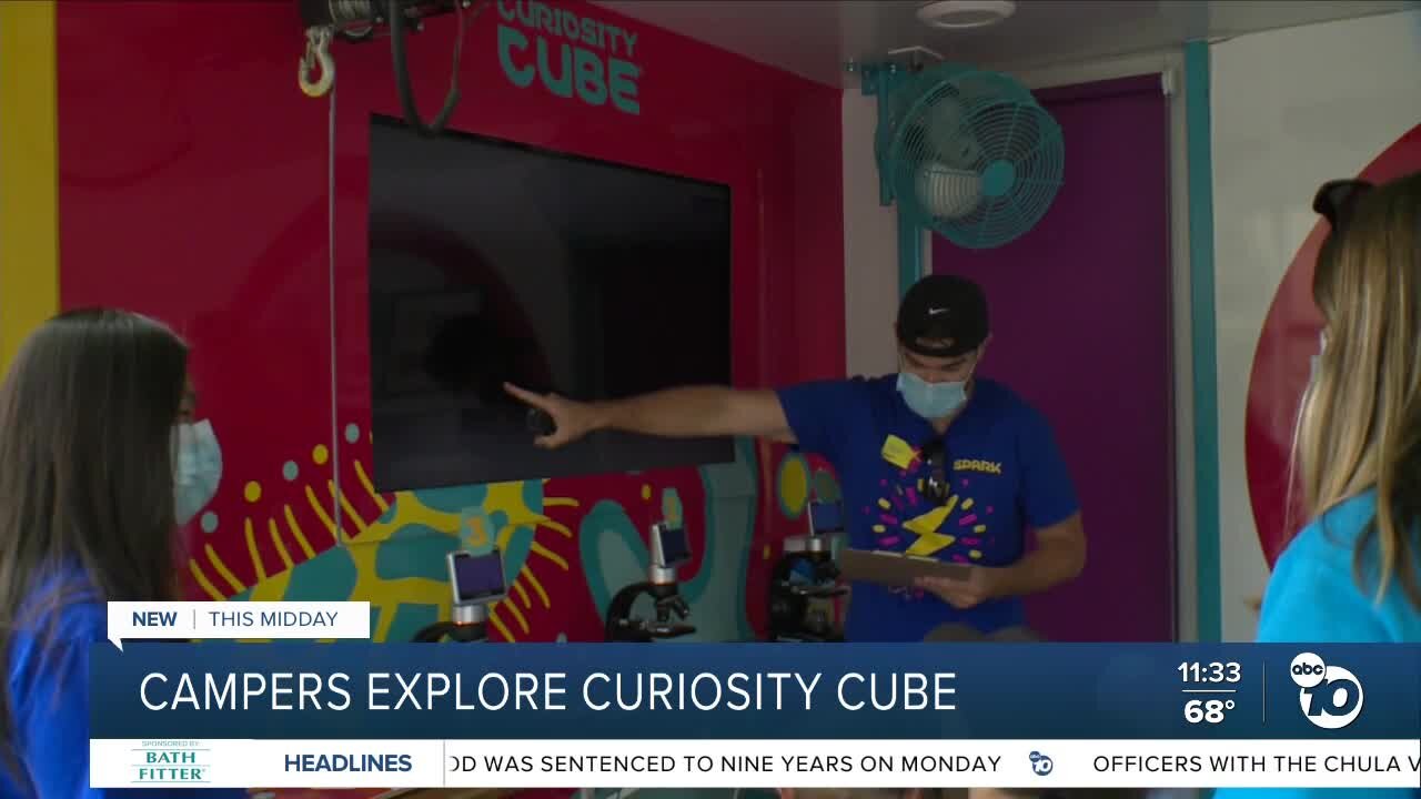 Camper explore curiosity cube