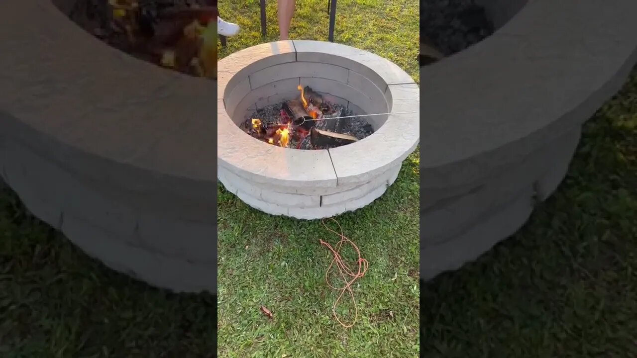 Cooking hotdogs over a fire