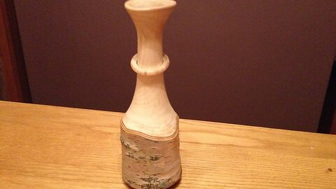 woodturning - A captive Ring on a natural edge silver birch vase