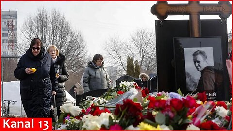 People in Moscow bring flowers to Navalny's grave on day of memoir release