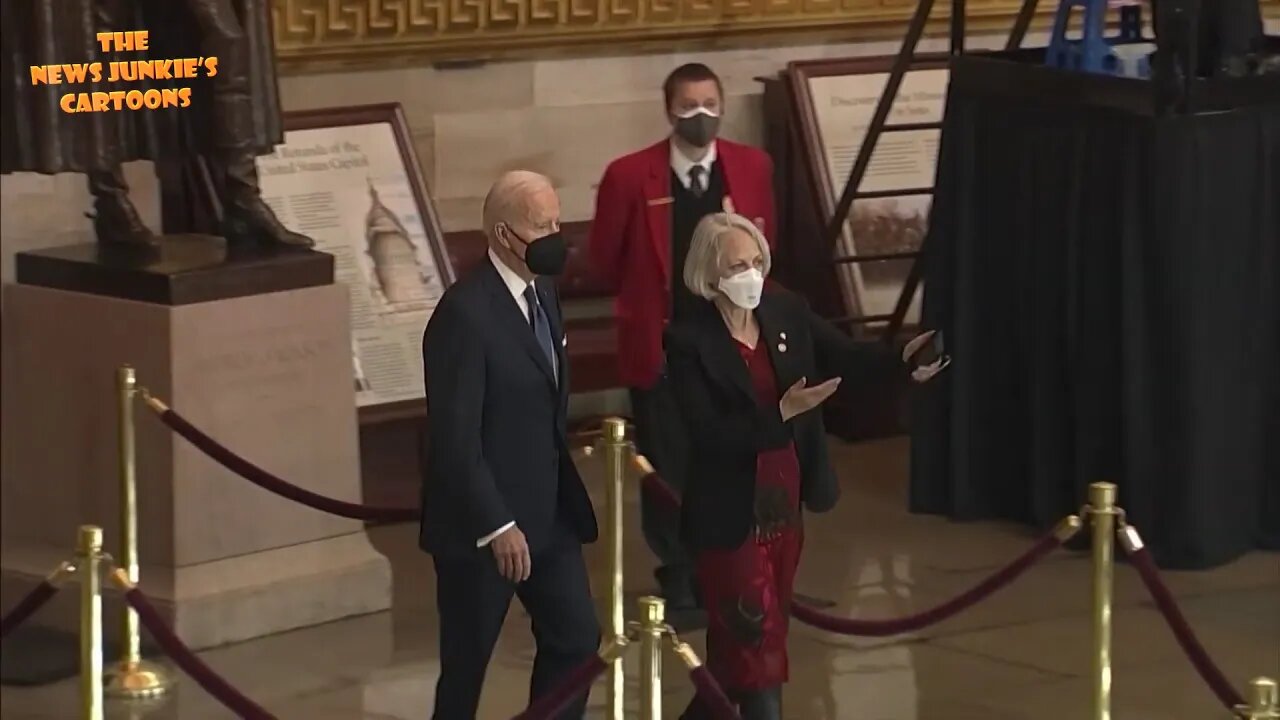Biden visits Democrat Harry Reid's coffin in state at the Capitol.