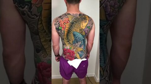 Beautiful Koi Fish Back Tattoo