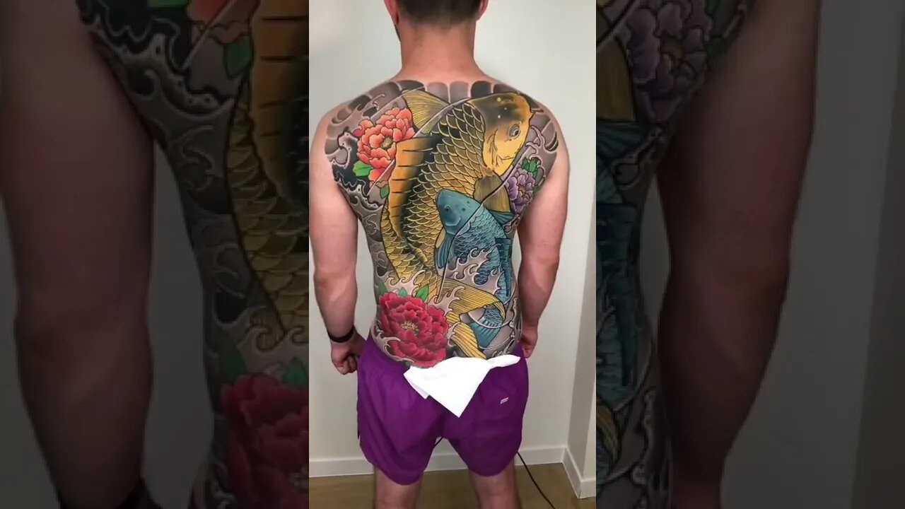 Beautiful Koi Fish Back Tattoo