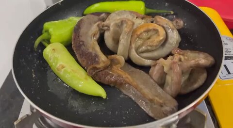 Eating pork intestines