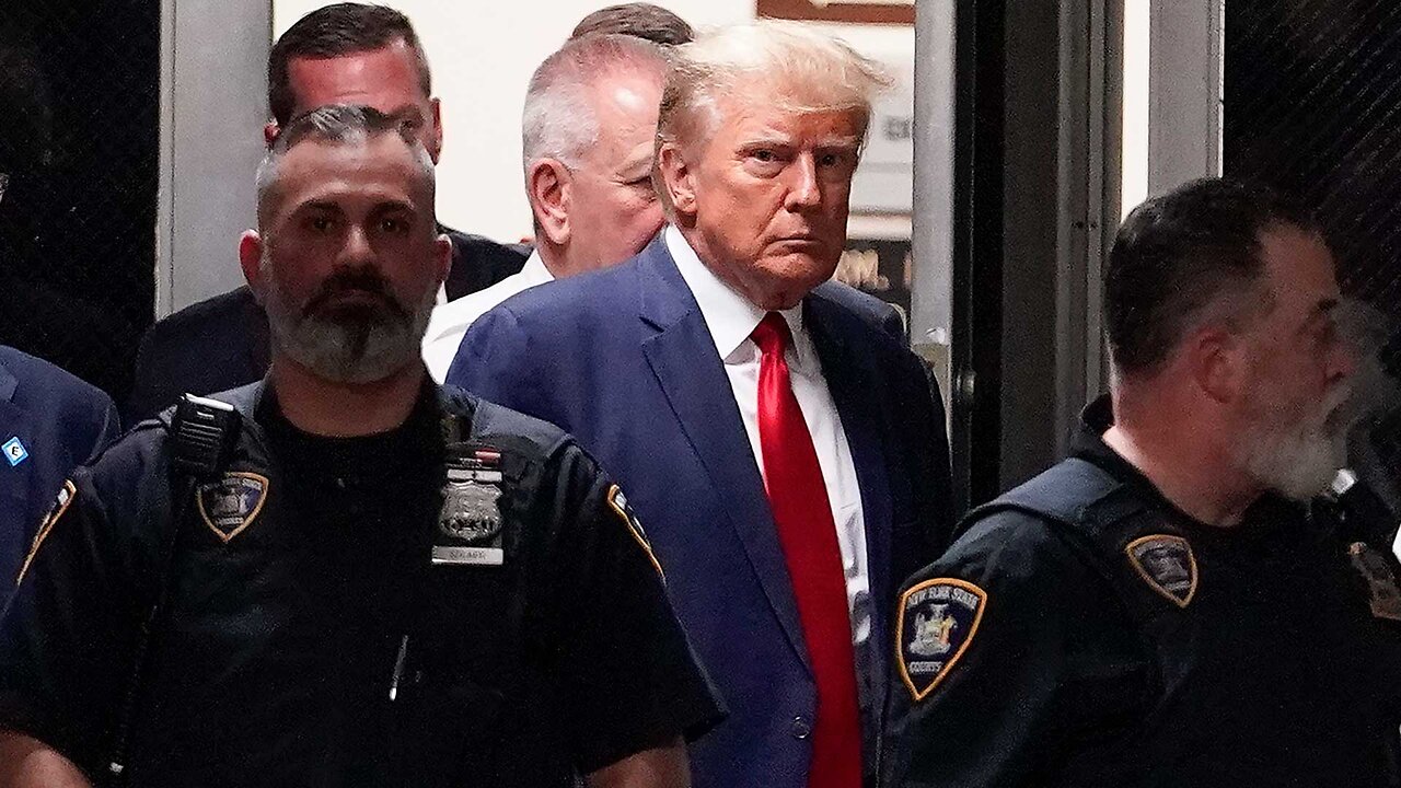 Donald Trump enters New York City courtroom following arrest processing