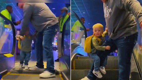 This cute little kid is afraid of the escalator