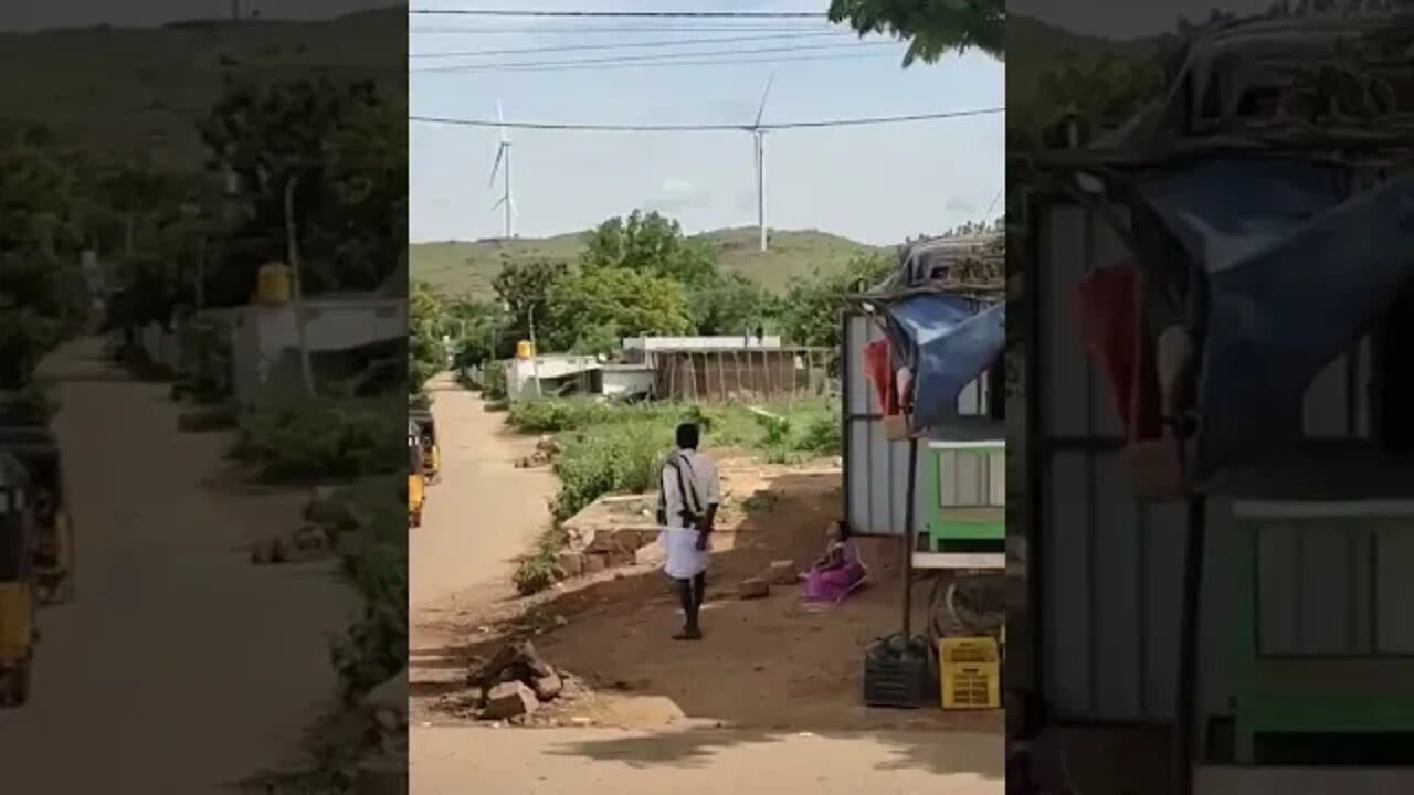 A beautiful view of a windmill taken from the bus,#shorts,#tourvlog,#windmill,#renewableenergy