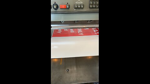 Trimming poster at printer from la