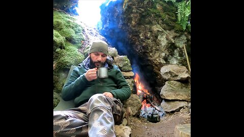 Winter snow camping in the wildernes and outdoor cooking