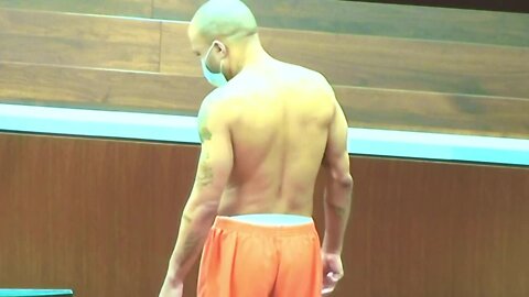 Darrell Brooks takes his shirt off in court