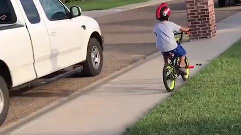 Boy Rides Bike Across Street and Runs into Brick Post