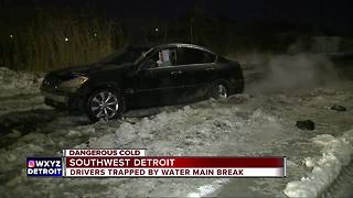 Water main break trapping cars in southwest Detroit