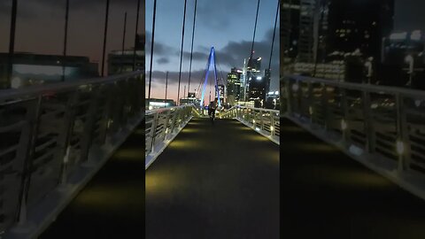 Cyclist across the drawbridge.