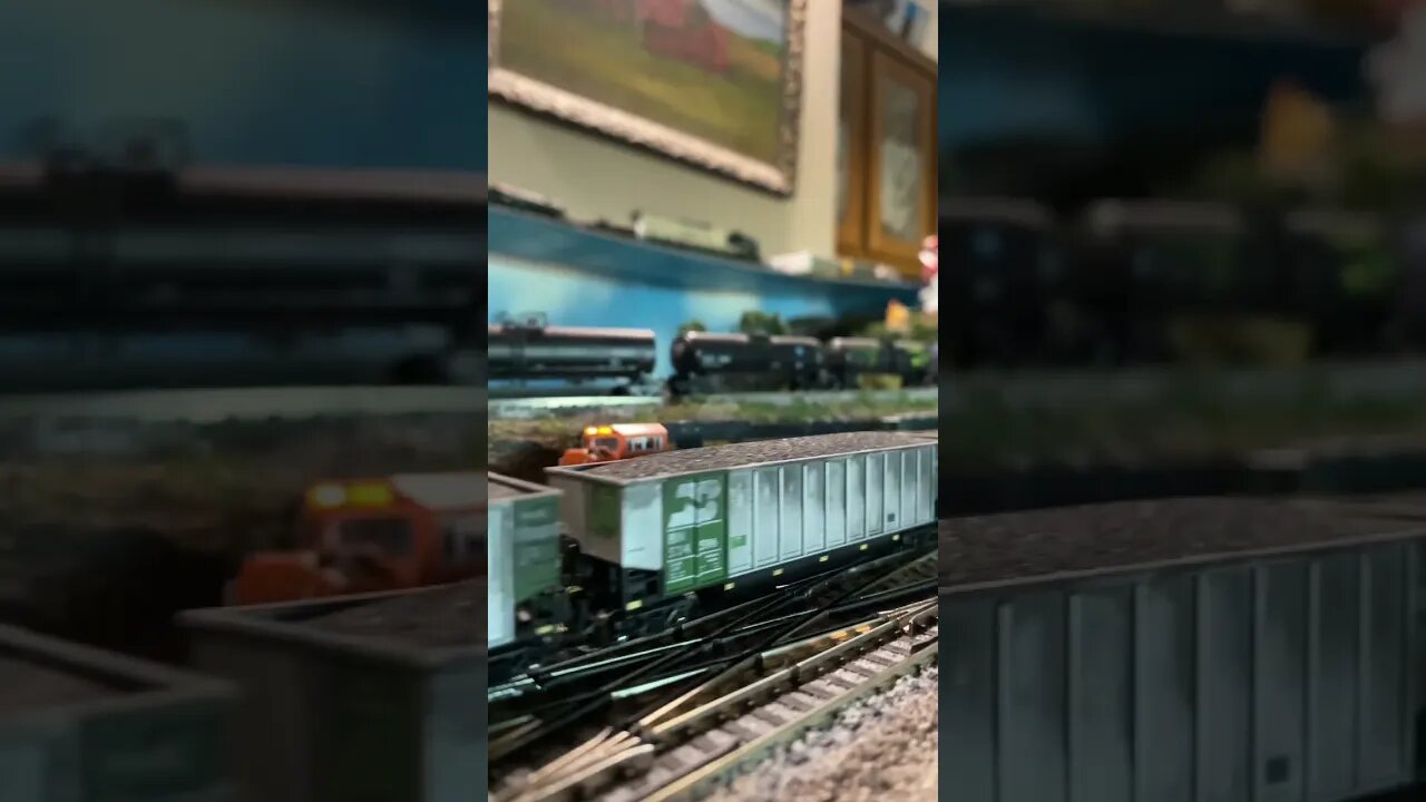 N Scale SD90Mac leads coal train