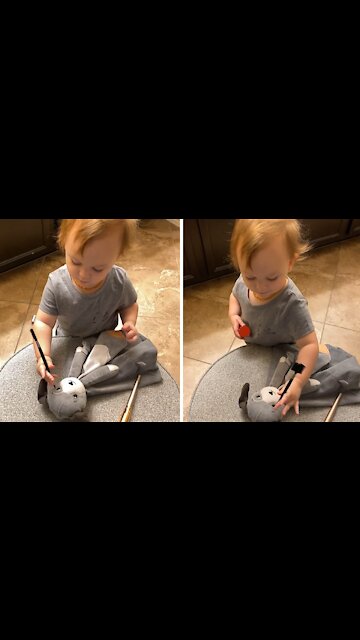 Precious Toddler Adorably Applies Makeup To Stuffed Animal