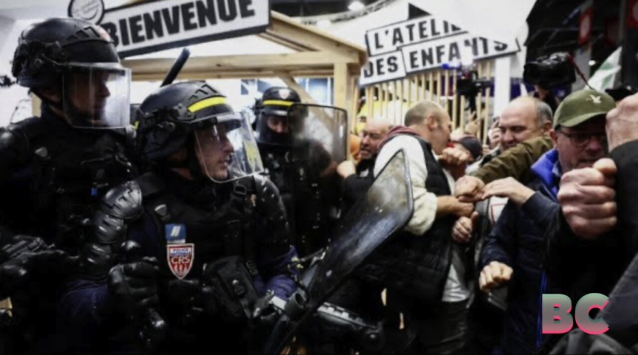 Angry French farmers storm into Paris agriculture fair