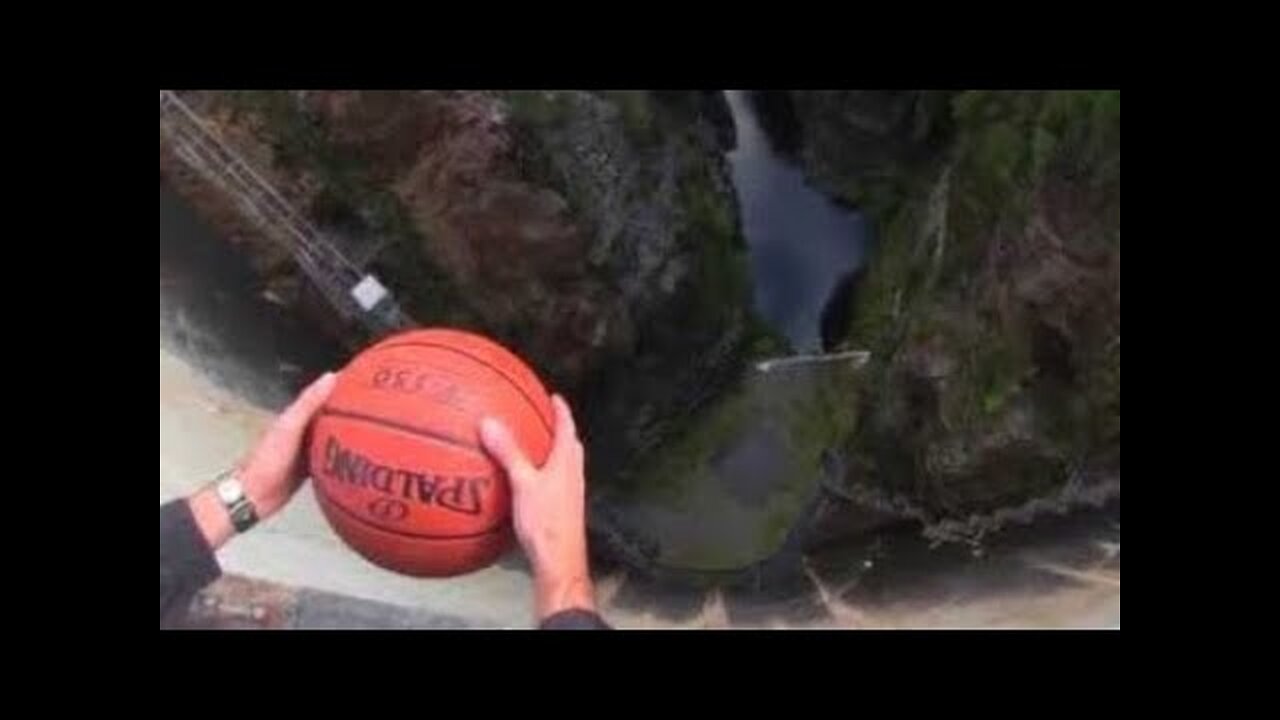 What Happens When a Spinning Basketball is Thrown Off a Dam!