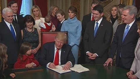 President Trump begins signing in his staff into office