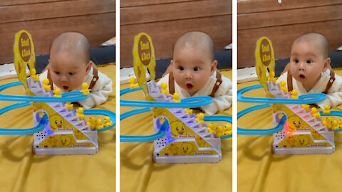 cute baby reaction on his new toy