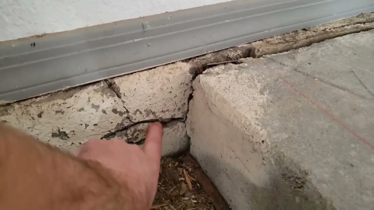 Cracking foundation wall caused by swelling supportive rebar.