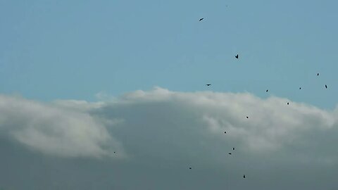 clouds pouring themselves over mountains on April 10, 2022