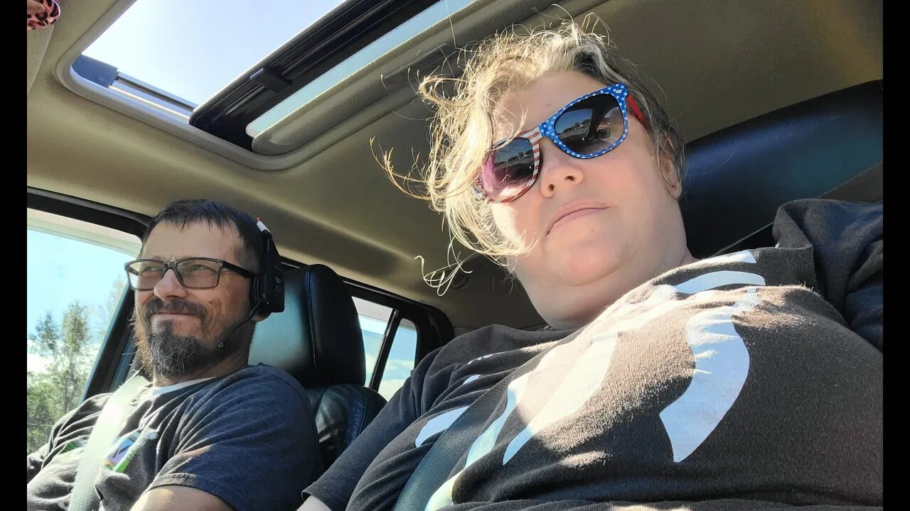 A VET AND HIS GIRL DRIVING AROUND