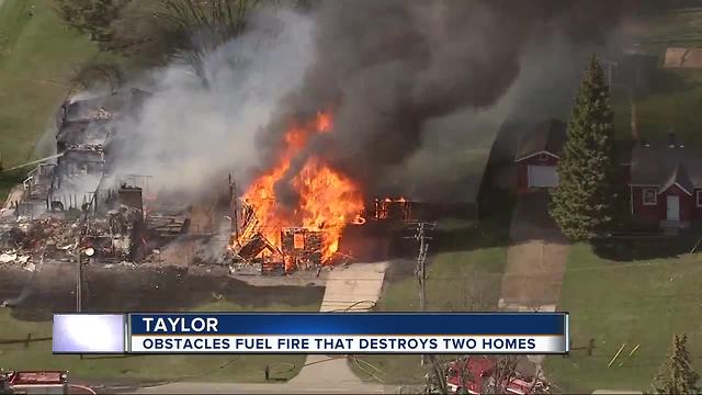 Large fire destroys two Taylor homes, forces families out