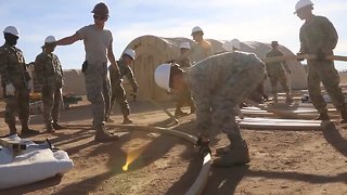 Airmen assemble tent to support troops deployed to border