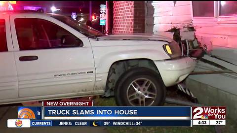 Truck slams into house near I-244 and Delaware