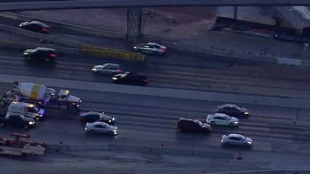 Car blocking center lane on I-15, near Spaghetti Bowl